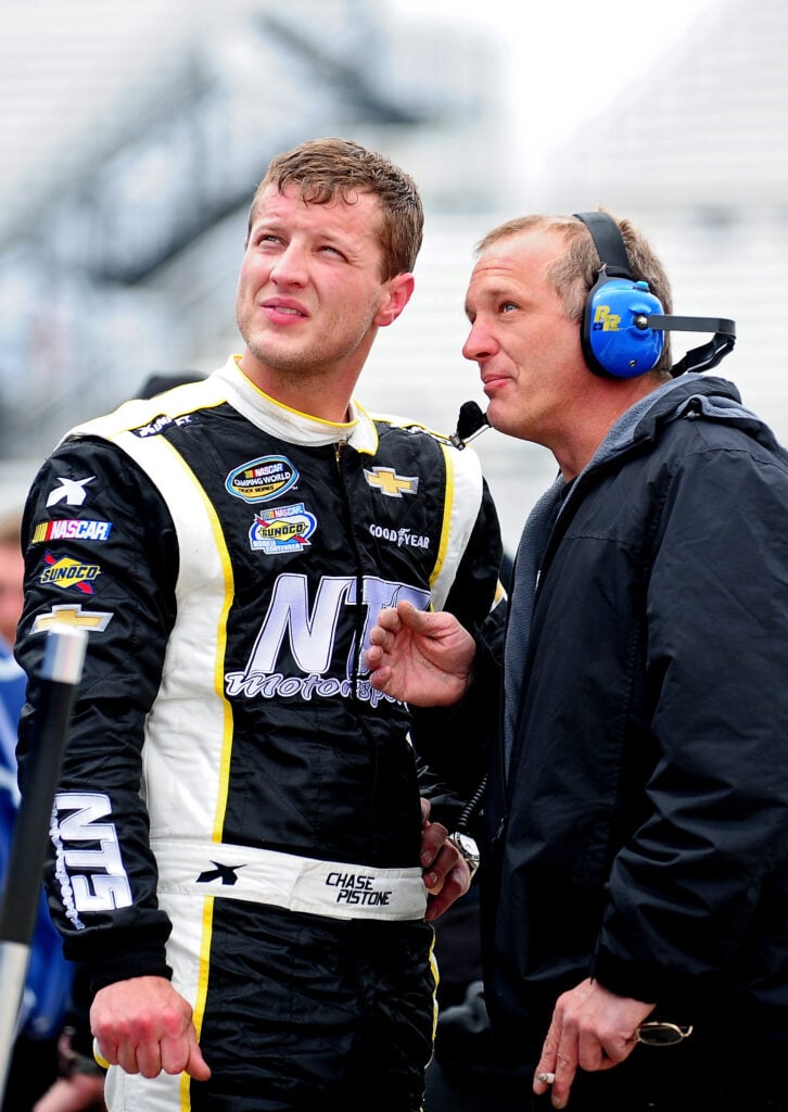 nogginroundup.com / NTS Motorsports Chevrolet, left, talks with a crew member during practice for the NASCAR Camping World Truck Series Kroger 250 at Martinsville Speedway on March 28, 2014 in Martinsville, Virginia. 