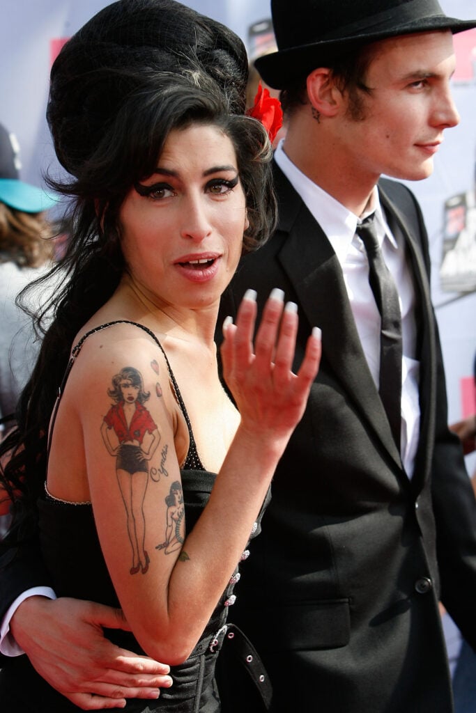Musician Amy Winehouse (L) and husband musician Blake Fielder-Civil (R) arrive to the 2007 MTV Movie Awards held at the Gibson Amphitheatre on June 3, 2007 in Universal City, California.  
