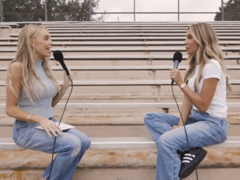 Alex Cooper and Alix Earle on bleachers.