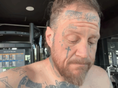 Jelly Roll looks anxious while shirtless.