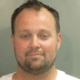 Josh Duggar's initial mugshot.