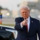 U.S. President Donald Trump waves to the media after walking off of Air Force One at Miami International Airport on April 11, 2026 in Miami, Florida.