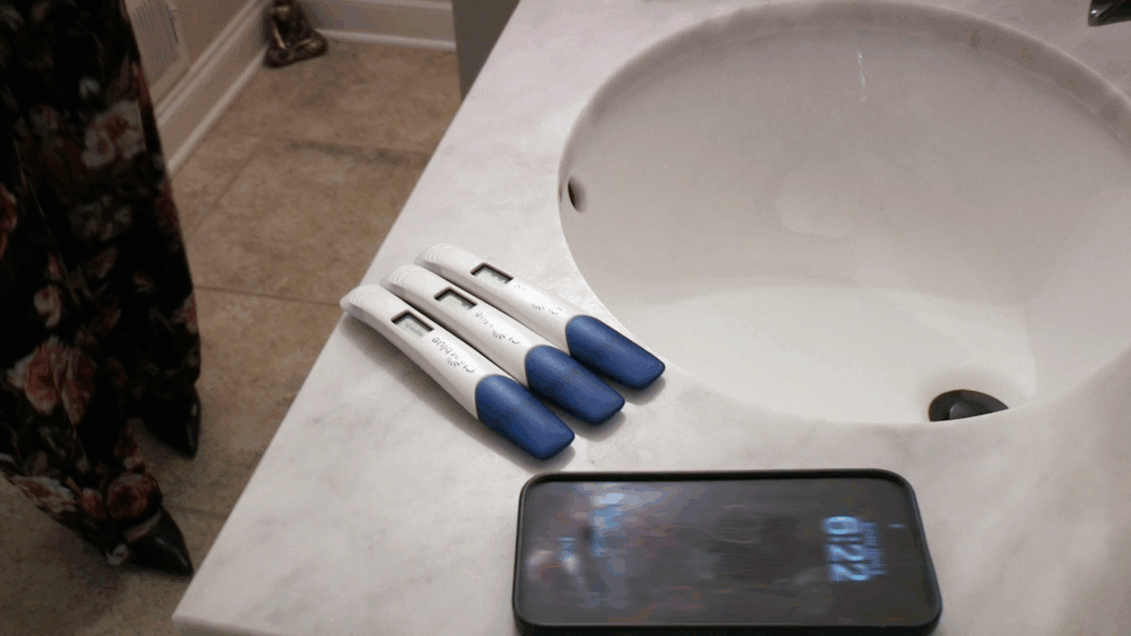 Three positive pregnancy tests.