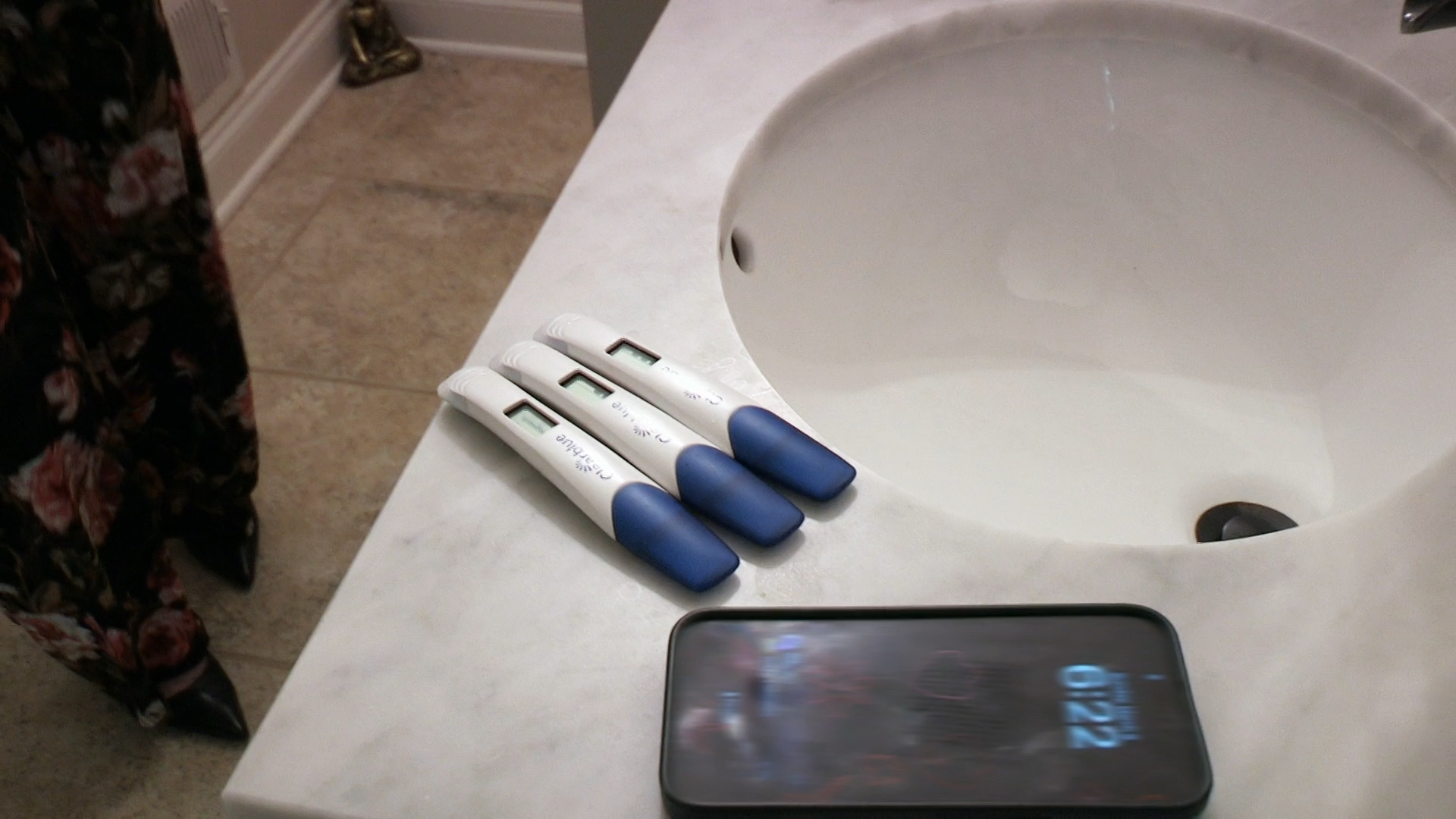 Three positive pregnancy tests.
