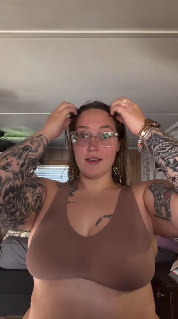 Lauren Pumpkin Shannon in a brown bra.