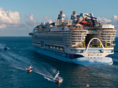 In an aerial view, Royal Caribbean's Icon of the Seas, billed as the world's largest cruise ship, heads out to sea for its second voyage from PortMiami on February 03, 2024, in Miami, Florida.