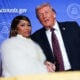 Musician Nicki Minaj joins U.S. President Donald Trump on stage as he delivers remarks during the Treasury Department's Trump Accounts Summit at Andrew W. Mellon Auditorium on January 28, 2026 in Washington, DC.