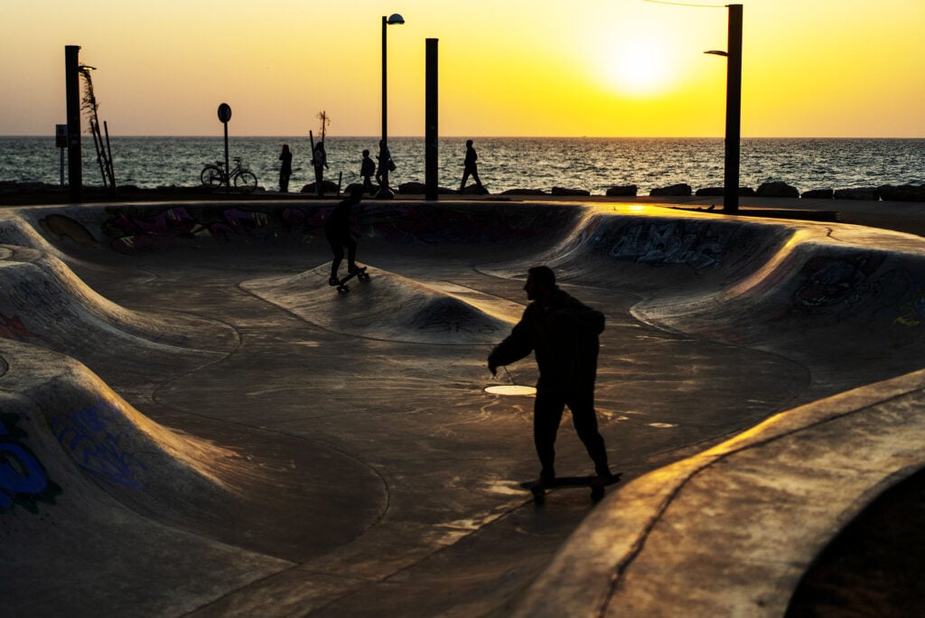 People skateboard at a seafront park on March 11, 2026 in Tel Aviv, Israel. Iran has continued firing waves of drones and missiles at Israel after the United States and Israel launched a joint attack on Iran early on February 28th.