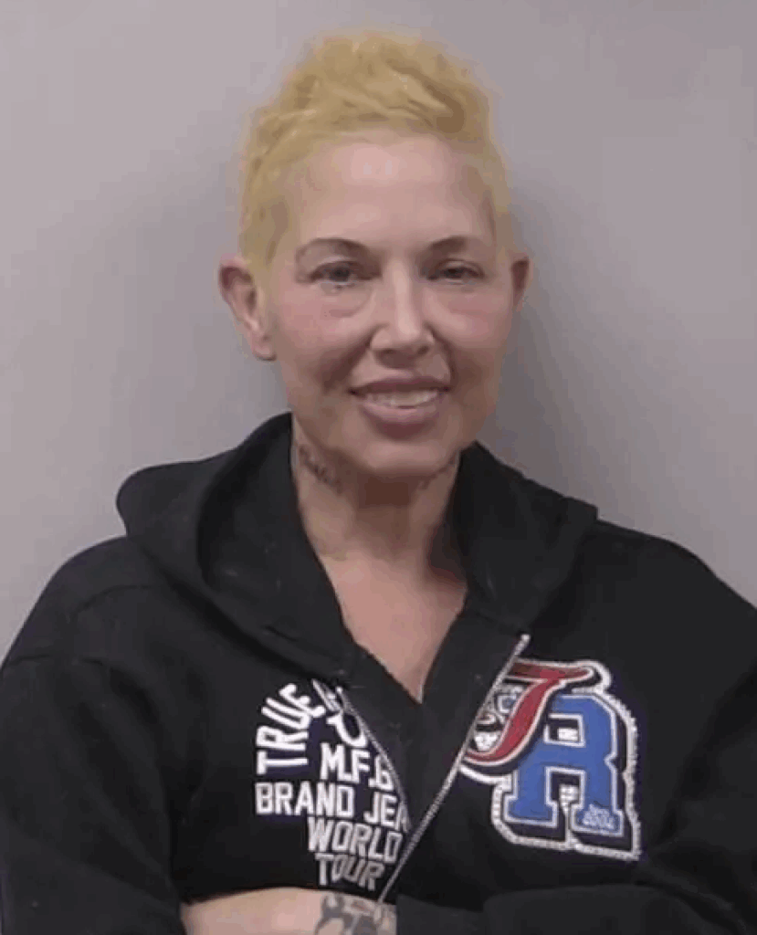 Kim Mathers smiles for the camera after her latest arrest.