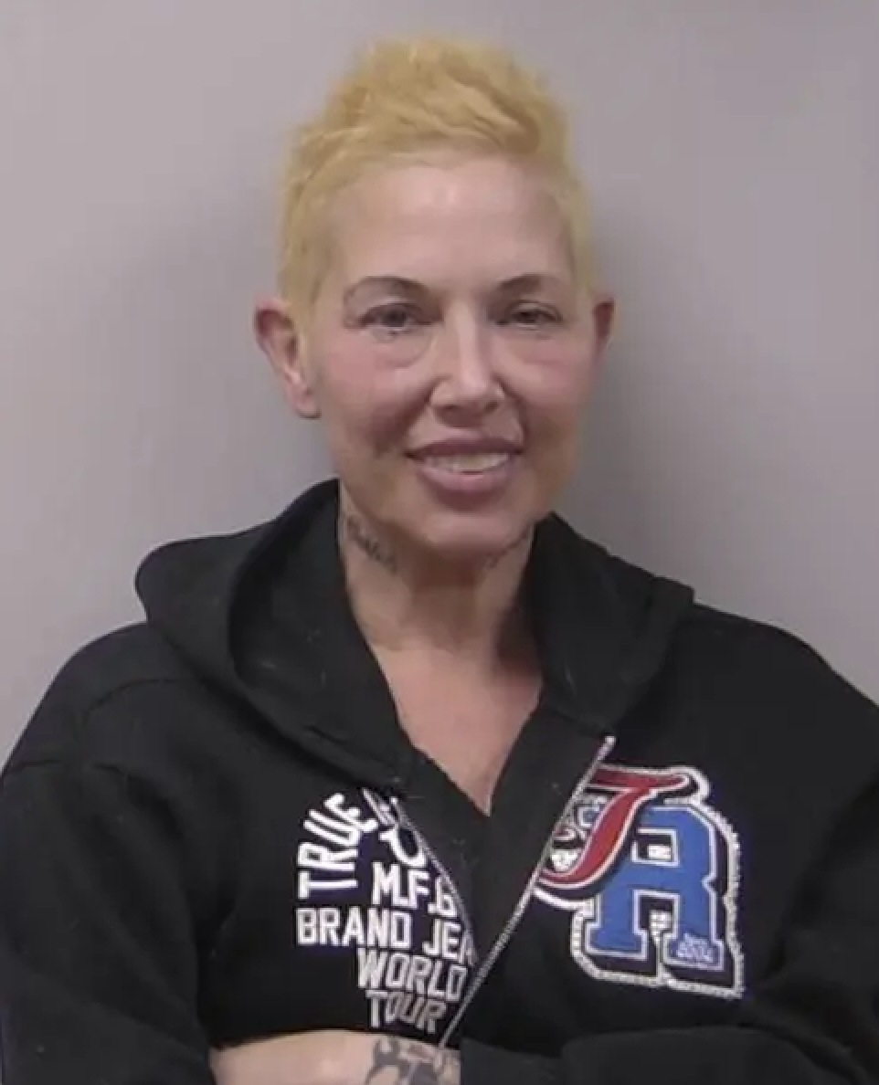 Kim Mathers smiles for the camera after her latest arrest.