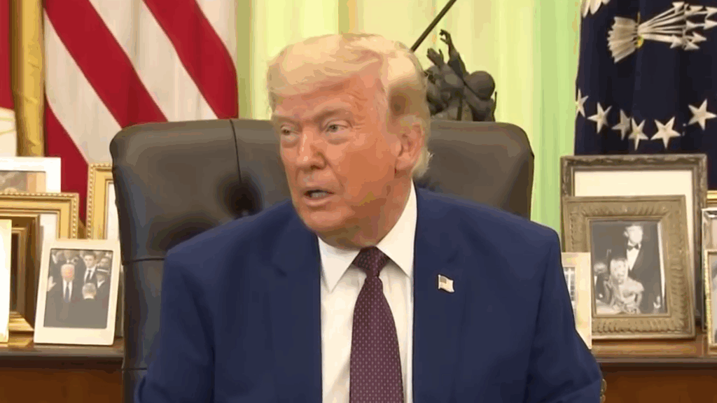 Donald Trump rants from his desk.