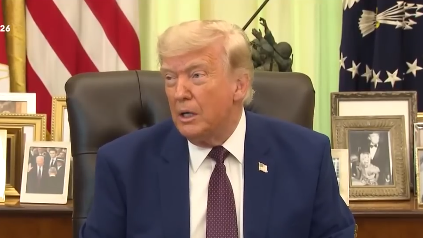 Donald Trump rants from his desk.