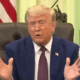 Donald Trump appears to play an imaginary accordion in the oval office.