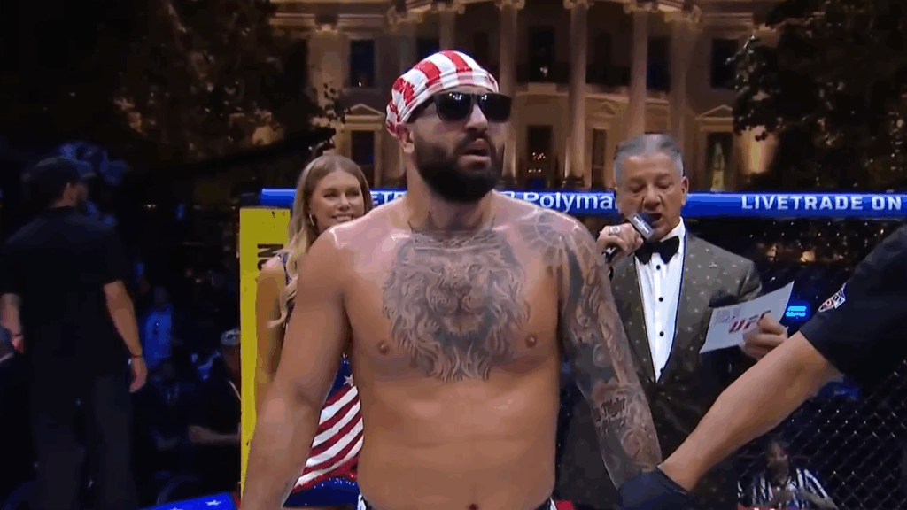 Josh Hokit stands, post-victory, in the UFC "cage" on the White House lawn.