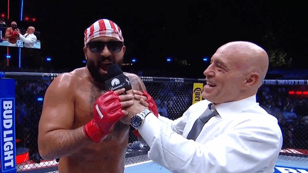 Joe Rogan interviews Josh Hokit inside the UFC "cage" on the White House lawn.