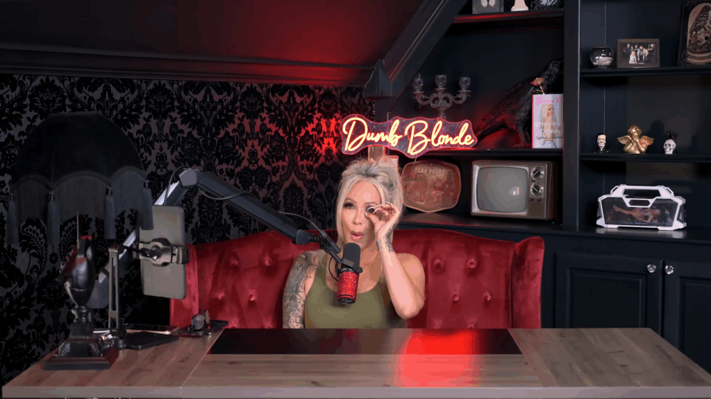 Bunnie Xo carefully wipes an eye on her podcast.