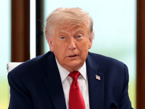U.S. President Donald Trump arrives for a working session on promoting economic growth with G7 leaders and G7 outreach partners as German Chancellor Friedrich Merz looks on, during the G7 Summit on June 17, 2026 in Evian-les-Bains, France.