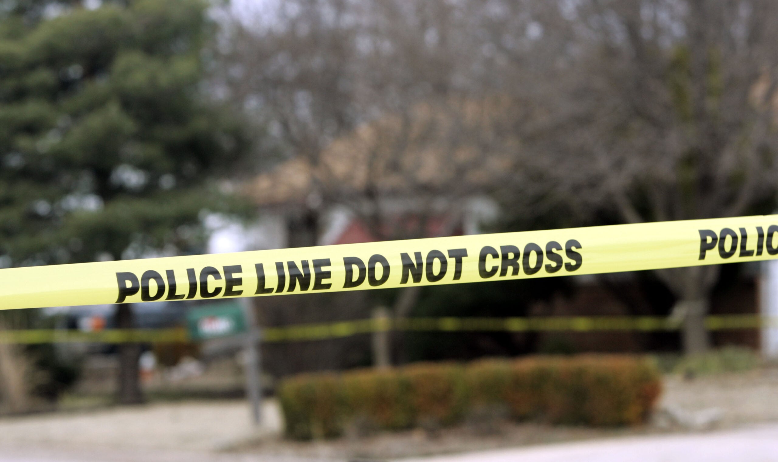 Police tape hangs across the street in front of the house that Dennis Rader lives in February 26, 2005 in Park City, Kansas. 