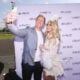 NFL Player Kroy Biermann (L) and TV Personality Kim Zolciak attend as Kim Zolciak hosts the Kentucky Derby hat contest at Empire City Casino at Yonkers Raceway on May 6, 2017 in Yonkers, New York.