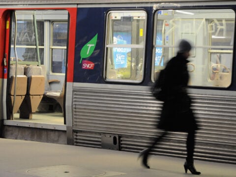 A commuter walks on a platform to catch her train at Paris Saint Lazare railway station on January 29, 2009 in Paris, France.