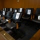 An empty jury box in a pre-trial courtroom.