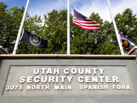 Flags fly at half-staff in front of the Utah County Security Center where 22-year-old Tyler Robinson, suspect in the killing political activist Charlie Kirk, is being held on September 12, 2025 in Spanish Fork, Utah.