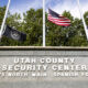 Flags fly at half-staff in front of the Utah County Security Center where 22-year-old Tyler Robinson, suspect in the killing political activist Charlie Kirk, is being held on September 12, 2025 in Spanish Fork, Utah.