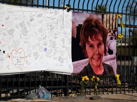 A photograph of Nancy Guthrie is seen on a sign that people can leave messages on February 26, 2026, in Tucson, Arizona.