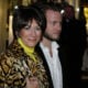 Socialite Ghislane Maxwell with an unidentified male companion attends the Opening of the Asprey Flagship Store on 5th Avenue December 8, 2003 in New York City.