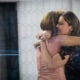 Hoda Kotb and Savannah Guthrie embrace at the end of the show on the set of NBC's Today Show, November 29, 2017 in New York City.