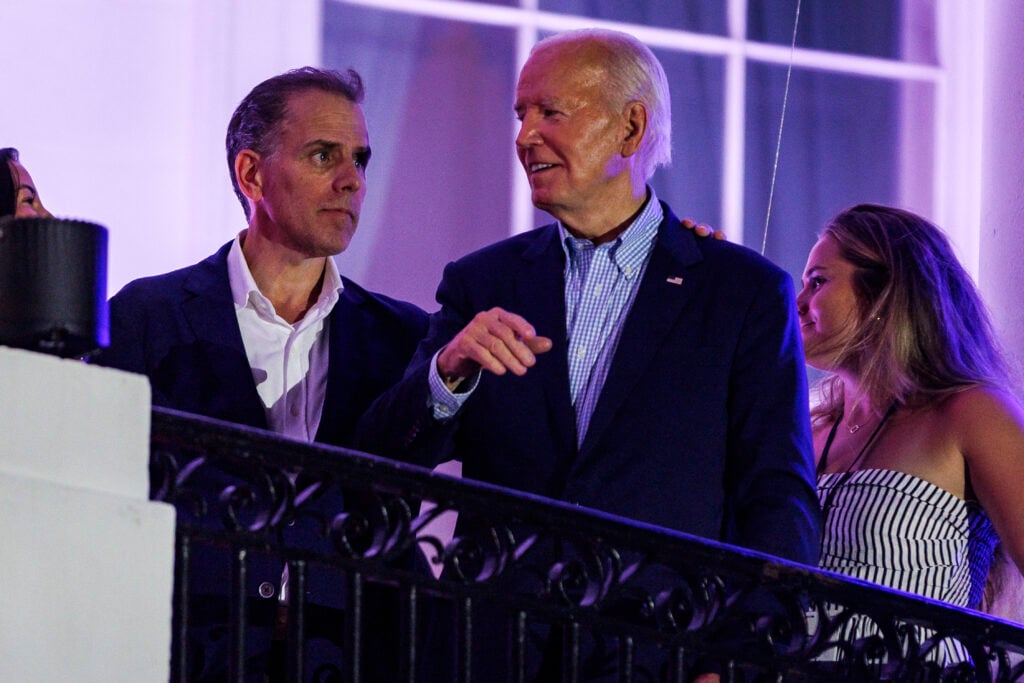 President Joe Biden talks to his son, Hunter Biden, following the fireworks on the National Mall with First Lady Jill Biden and Second Gentleman Doug Emhoff from the White House balcony during a 4th of July event on the South Lawn of the White House on July 4, 2024 in Washington, DC.
