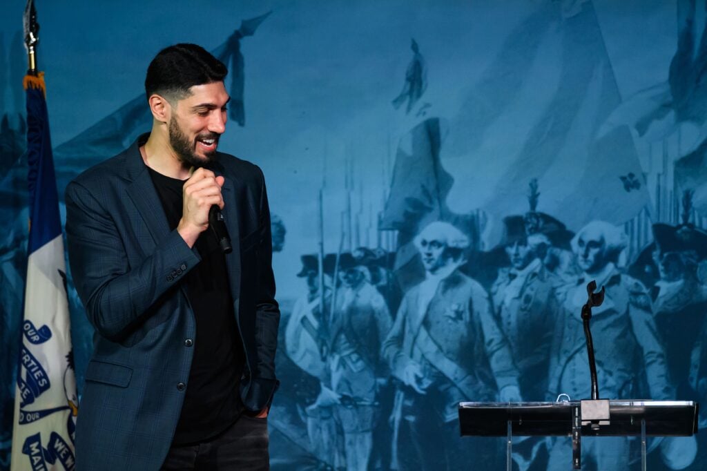 Turkish and American former basketball player Enes Kanter Freedom speaks onstage at an Americans for Prosperity event at the Adventureland amusement park on August 22, 2026 in Altoona, Iowa.