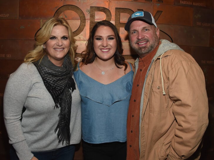 Singer/Songwriter Allie Colleen Brooks (center) Daughter of Garth Brooks and first wife Sandy Brooks poses with her stepmom Singer/Songwriter Trisha Yearwood and dad Singer/Songwriter Garth Brooks after making her Grand Ole Opry debut.