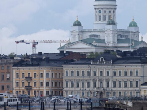 Helsinki cathedral looms over Helsinki harbor.