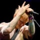 Ed Sheeran looks down while playing in December 2025.