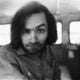 American criminal and cult leader Charles Manson (1934 - 2017) traveling on a police van to the Santa Monica Courthouse to appear in court for a hearing regarding the murder of music teacher Gary Hinman, Los Angeles, California, 25th June 1970.