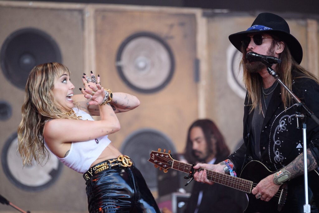 Miley Cyrus and her father Billy-Ray Cyrus perform on the Pyramid Stage on day five of Glastonbury Festival at Worthy Farm, Pilton on June 30, 2019 in Glastonbury, England.