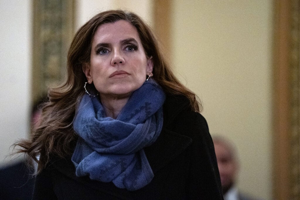 Rep. Nancy Mace (R-SC) looks on towards other members of Congress doing television interviews at the U.S.