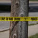 Police tape blocks off an area as investigators collect evidence after a man crashed his vehicle after being fatally shot during a confrontation with ICE officers on September 12, 2025 in Franklin Park, Illinois.