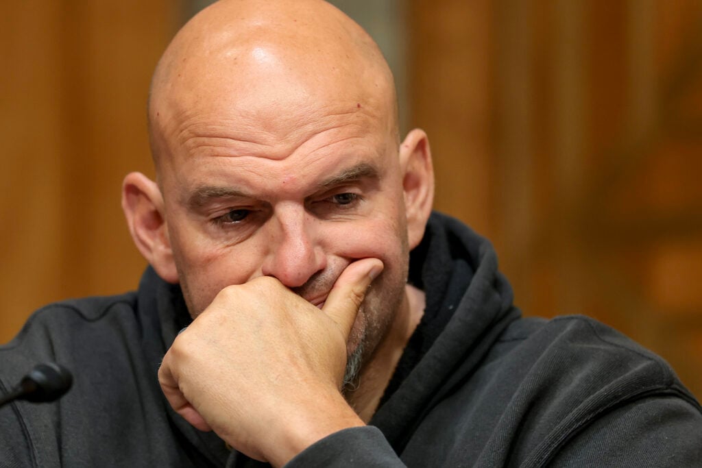 U.S. Sen. John Fetterman (D-PA) looks on during a business meeting with the Senate Homeland Security And Government Affairs Committee in the Dirksen Senate Office Building on August 06, 2026 in Washington, DC. 