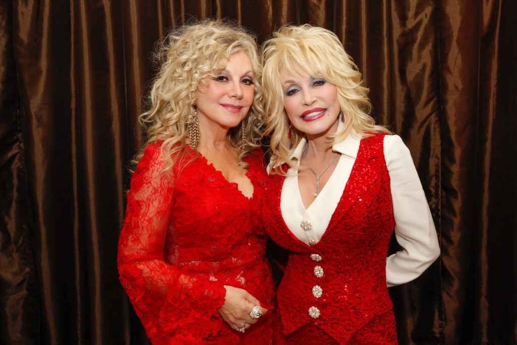 Stella Parton and Dolly Parton attend Stella Parton's Red Tent Women's Conference 2014 at the Doubletree Hotel Downtown on April 18, 2014 in Nashville, Tennessee.