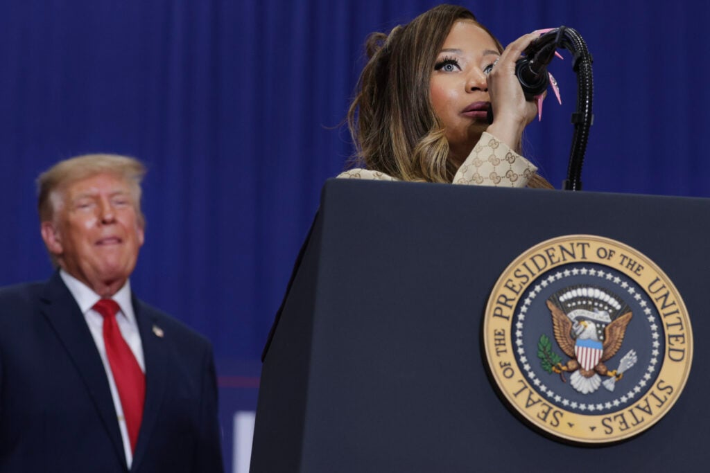 Nicki Minaj at the podium speaking for Donald Trump in October 2026.