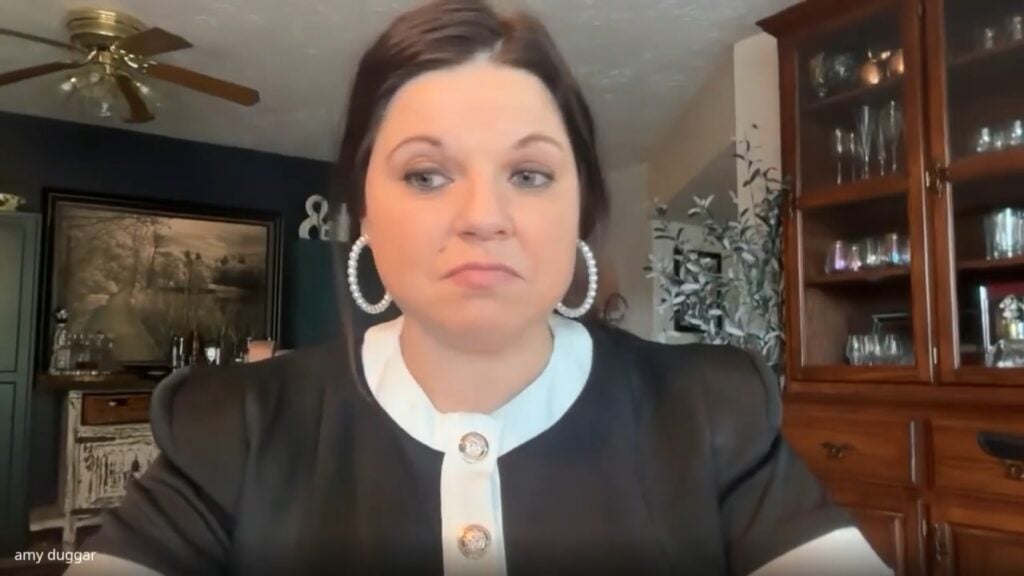 Amy Duggar on a podcast.