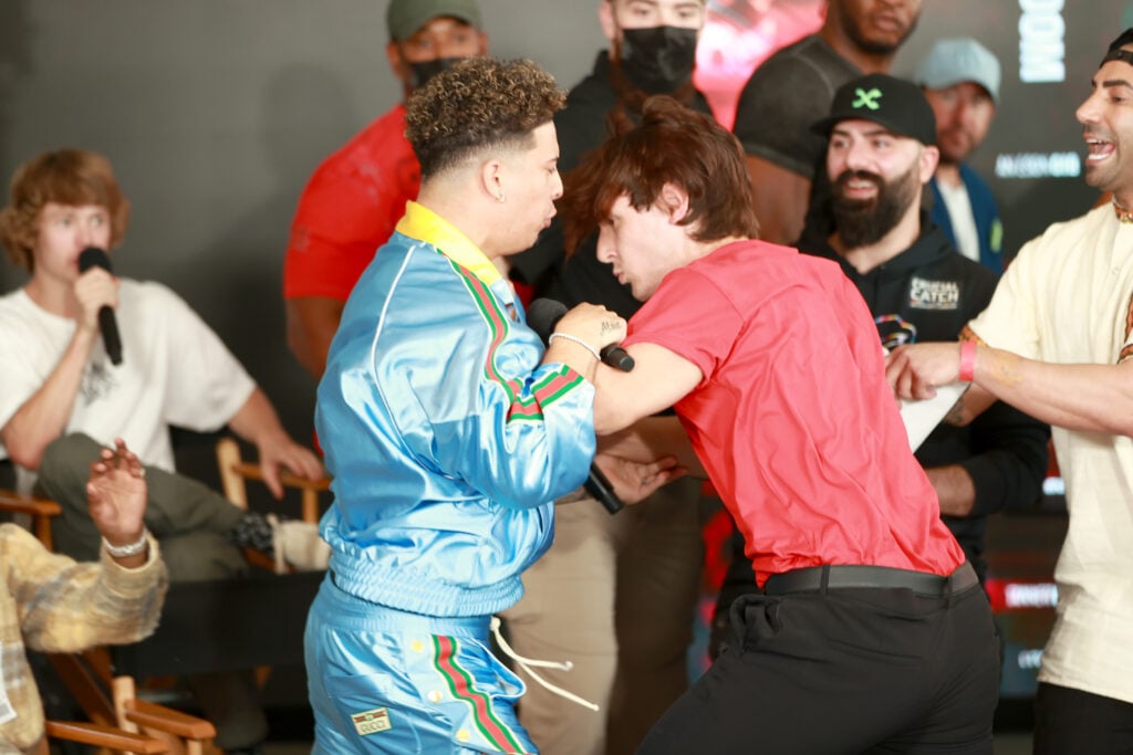 Austin McBroom (L) and Bryce Hall fight onstage during LiveXLive & Social Gloves: Battle of the Platforms Press Conference @ Fred Segal West Hollywood on May 18, 2021 in Los Angeles, California. 