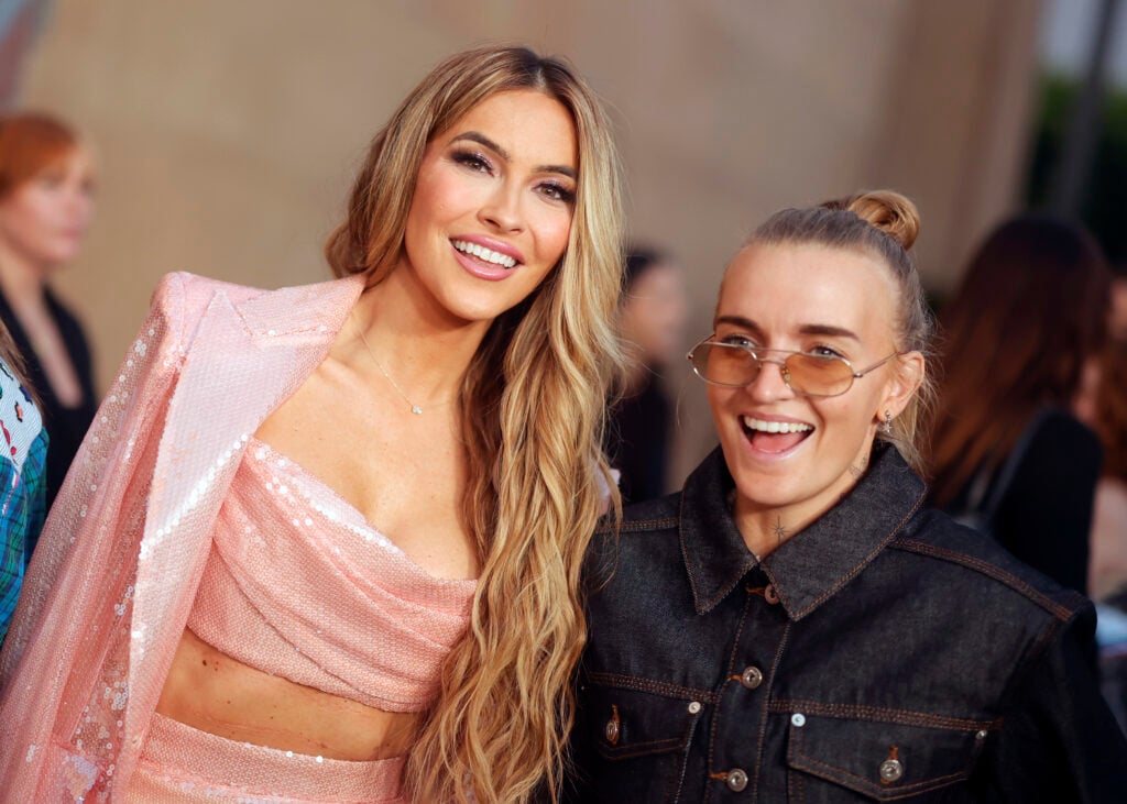 Chrishell Stause and G Flip attend Netflix's "Will & Harper" LA Premiere at The Egyptian Theatre Hollywood on September 19, 2024 in Los Angeles, California. 