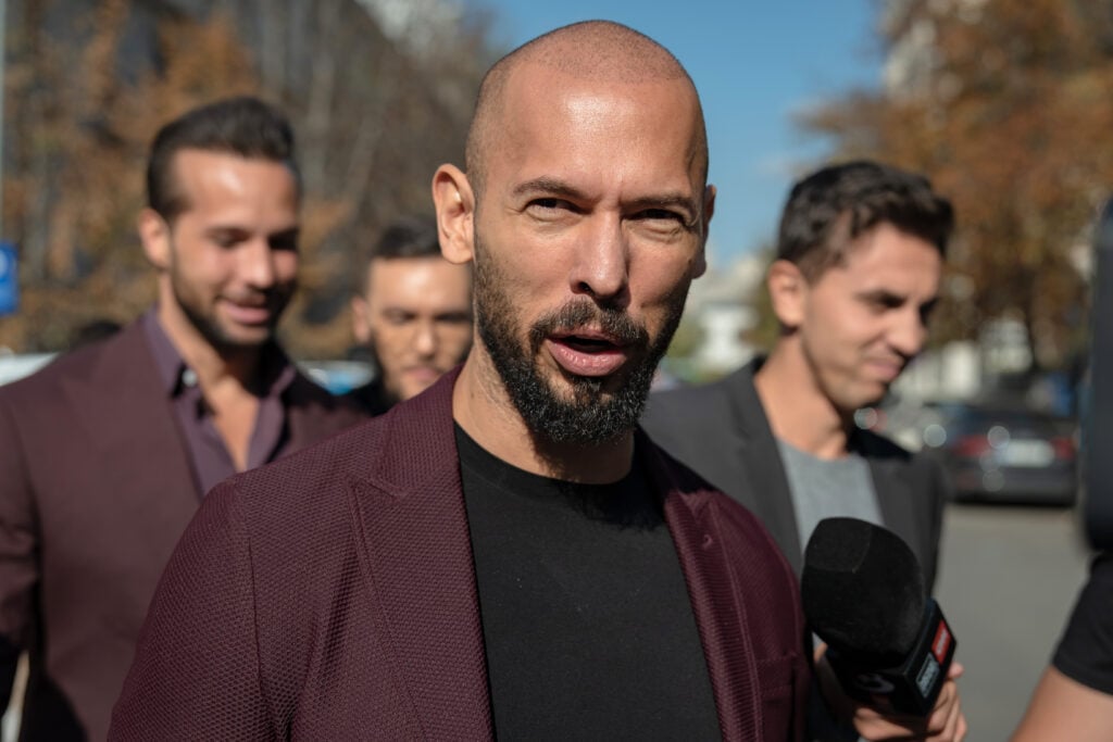 Andrew Tate talks to the media outside the Court of Appeal on October 15, 2024 in Bucharest, Romania. 