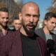 Andrew Tate talks to the media outside the Court of Appeal on October 15, 2024 in Bucharest, Romania.