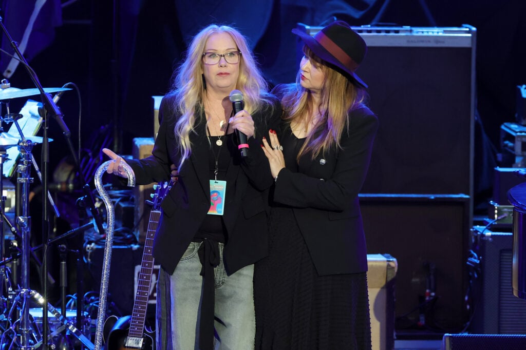 Christina Applegate (L) speaks onstage during the Light Up The Blues 7 Concert celebrating Autism Speaks' 20th Anniversary at the Greek Theatre on April 26, 2025 in Los Angeles, California. 