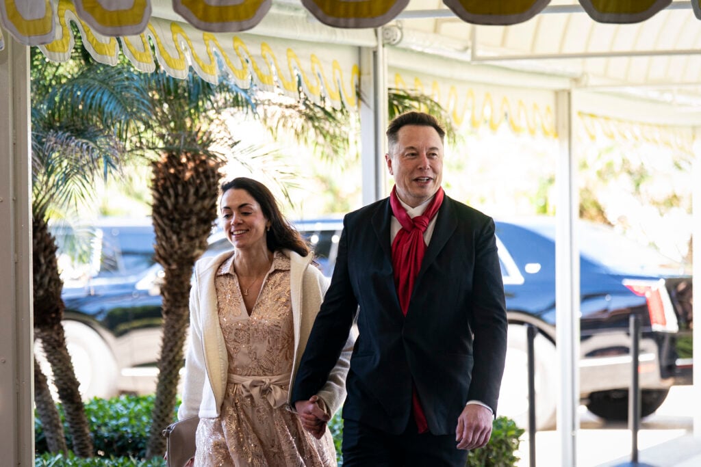 Elon Musk, CEO of Tesla and SpaceX, and Shivon Zilis, a venture capitalist, arrive at Mar-a-Lago on February 1, 2026 in Palm Beach, Florida.