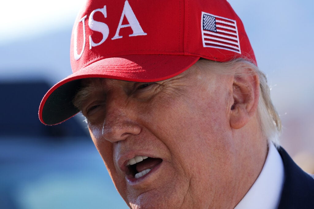 President Donald Trump speaks to members of the media before boarding Air Force One as he departs Laughlin/Bullhead International Airport following a rally on October 14, 2026 in Bullhead City, Arizona.